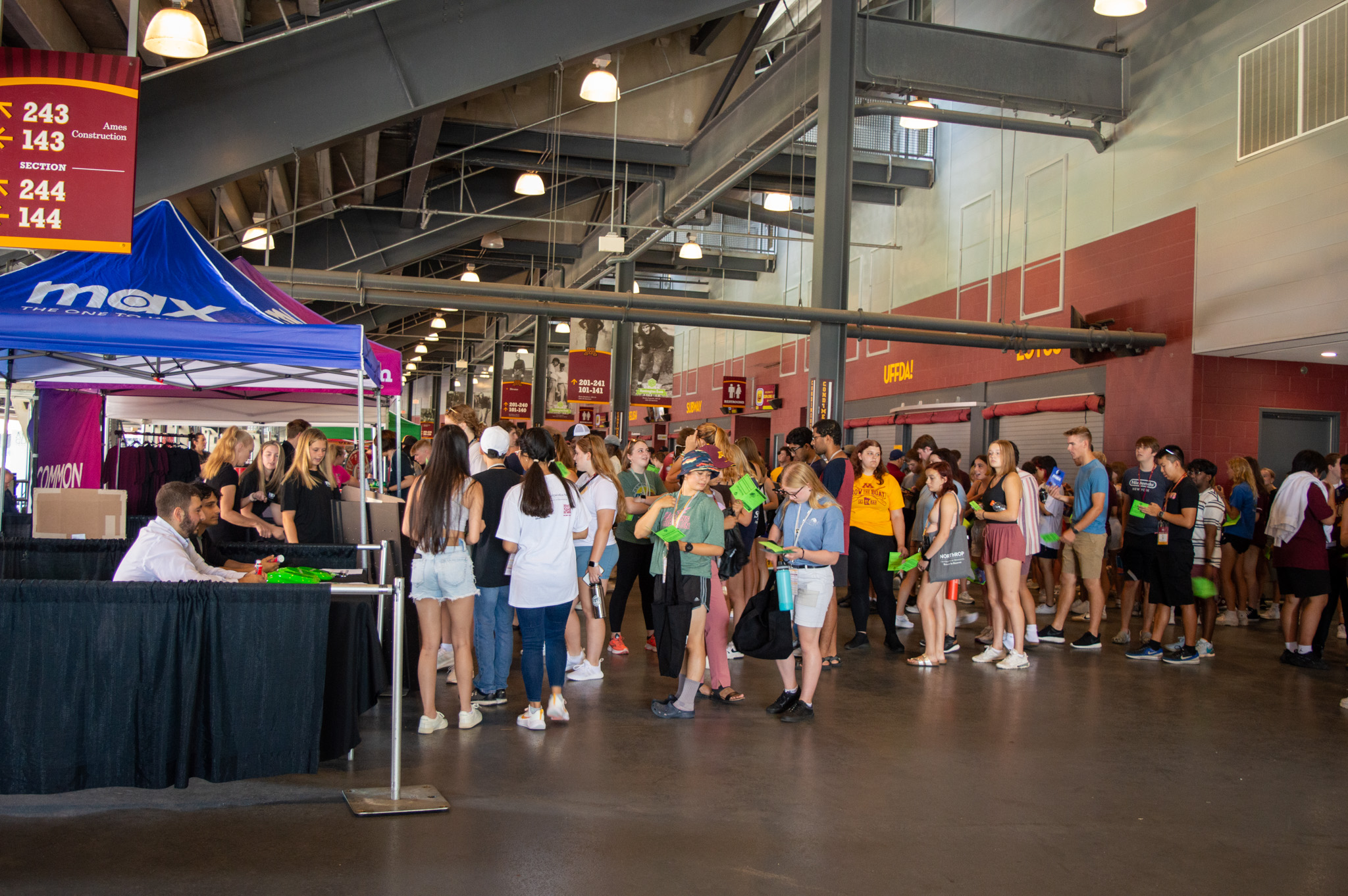 Students line up at booths at Explore U