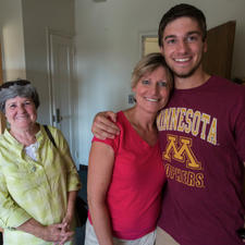 An incoming freshman hugs his family on move in day